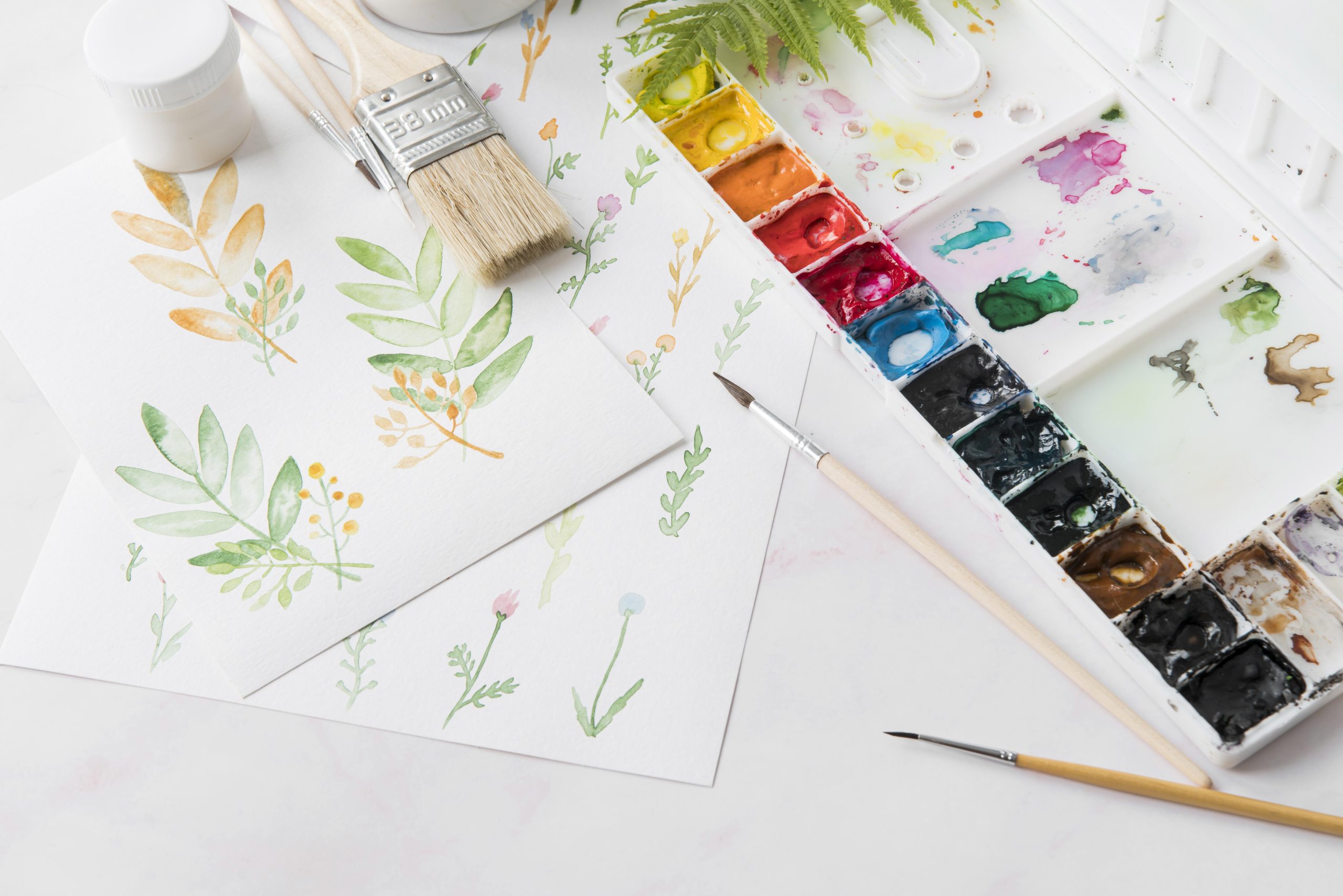 high-angle-arrangement-with-watercolors