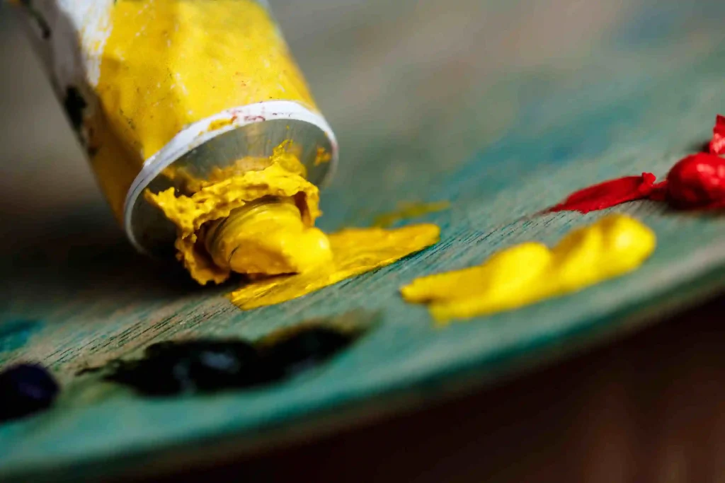 red-yellow-oil-paints-palette-wood-wall