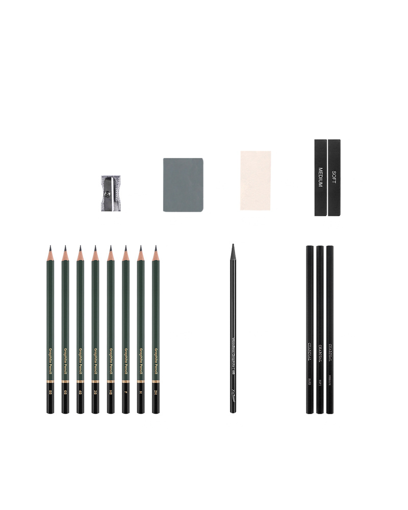 Charcoal and graphite pencil set with charcoal sticks, graphite pencils and charcoal pencils on a plain white background