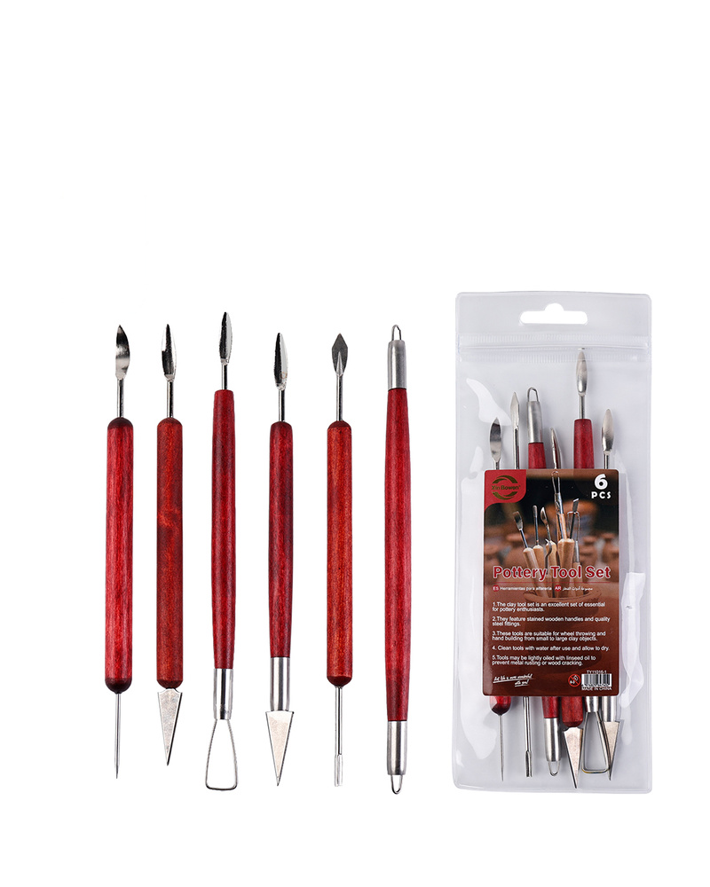 Red wood pottery clay sculpting tools on a plain white background